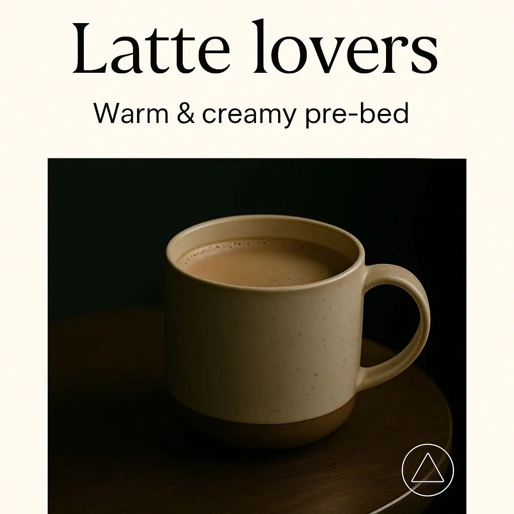 Mug of creamy latte on table